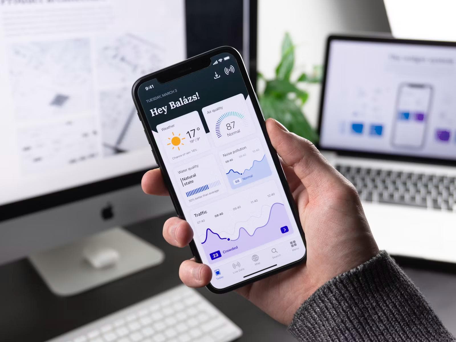A mobile app open on a phone held in one hand