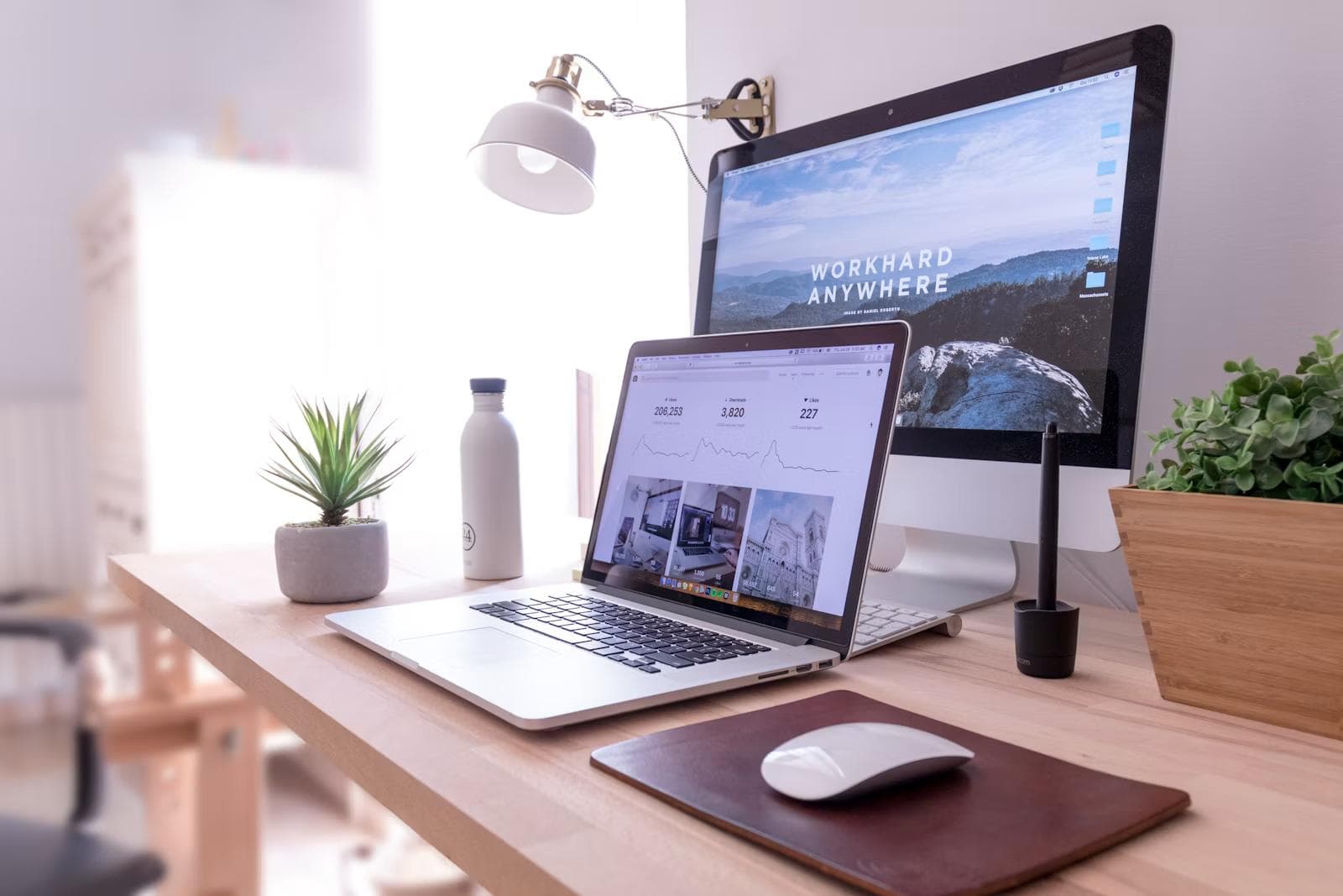 A brand website shown on a desktop monitor at a tidy desk
